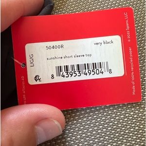 Spanx sunshine short sleeve top.  Black.  Size large. Brand new w tags